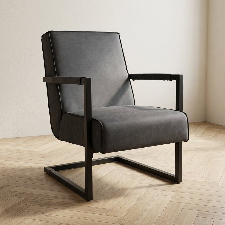 Industriële leren fauteuil antraciet Tiger sfeerfoto in modern interieur